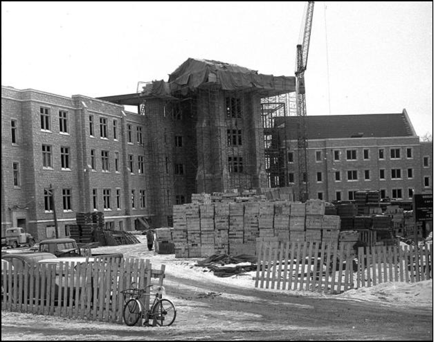 This picture from 1957 shows stacks of cut blocks of Whirlpool Sandstone being used to construct Middlesex College. 